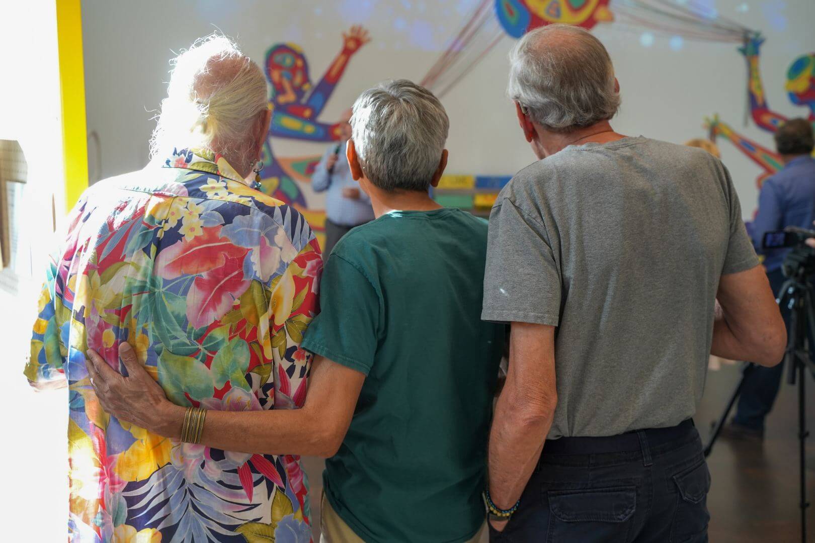 Three West of 50 members stand together at a Denver Art Museum event