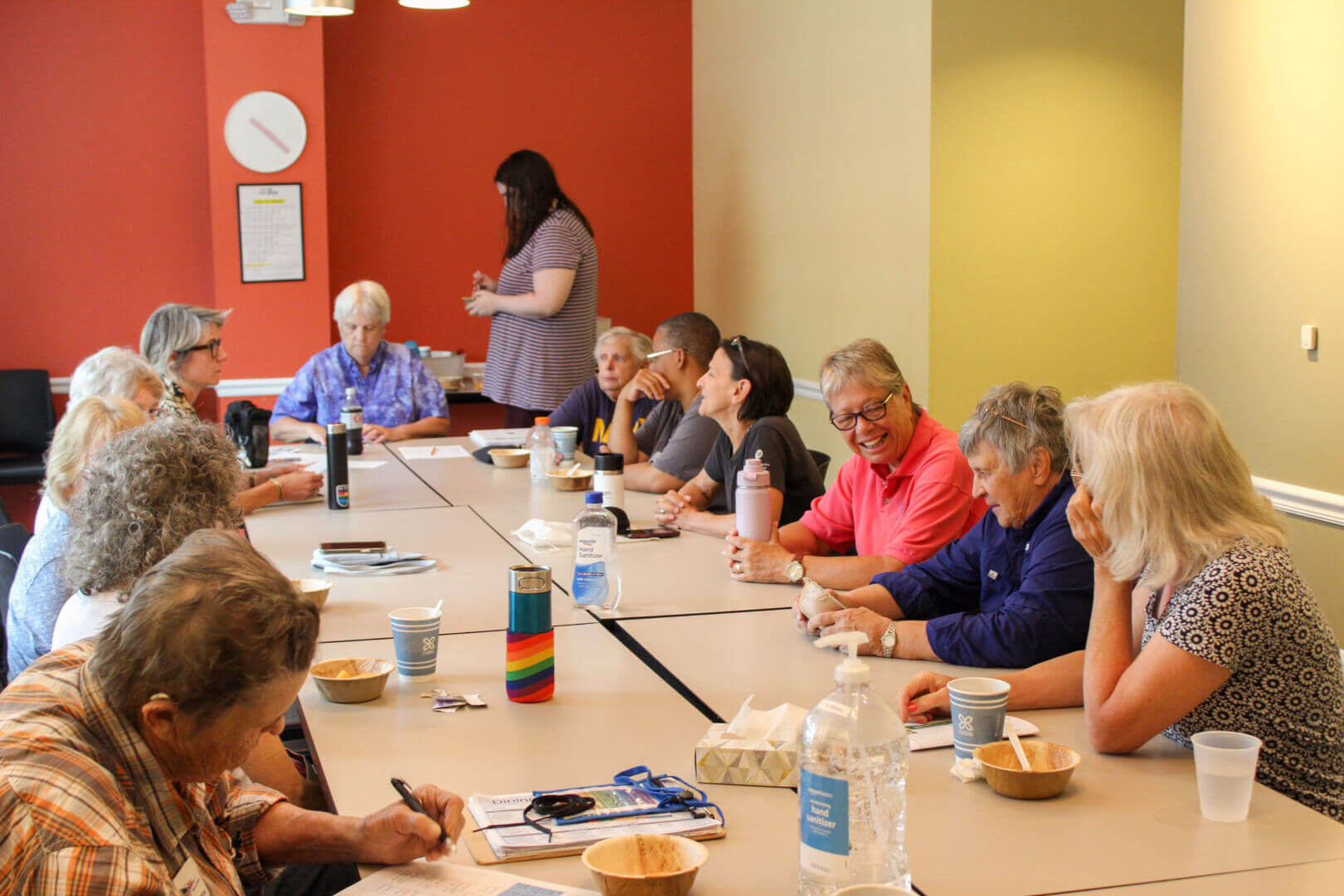 Members of West of 50's Lesbian Lounge group chat together over morning coffee and snacks