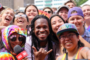 Community members pose together for a photo during Denver PrideFest