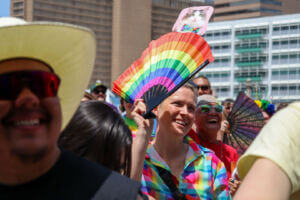 An attendee shows off their rainbow fan at Center Stage