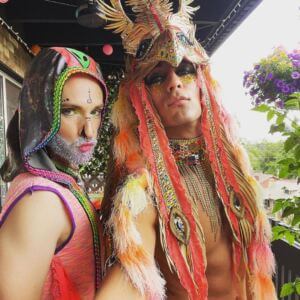 Gary and a friend pose for a photo in handmade garments.